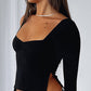 Plain long-sleeved top with square neckline and slit