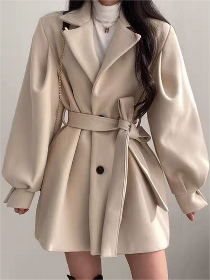 Coat with lapel collar, puff sleeves and belt