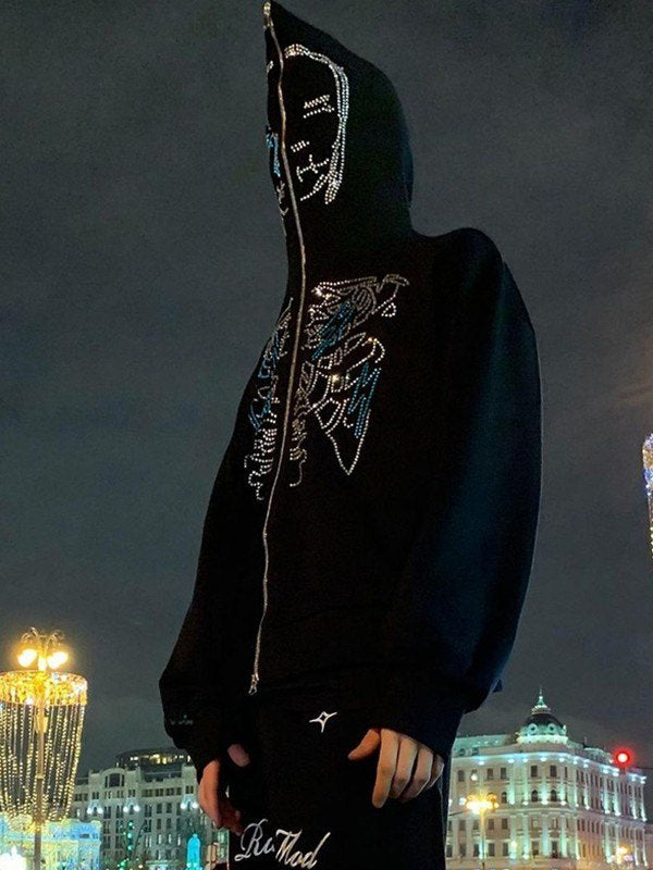 Zip up hoodie with glittering rhinestones and face motif