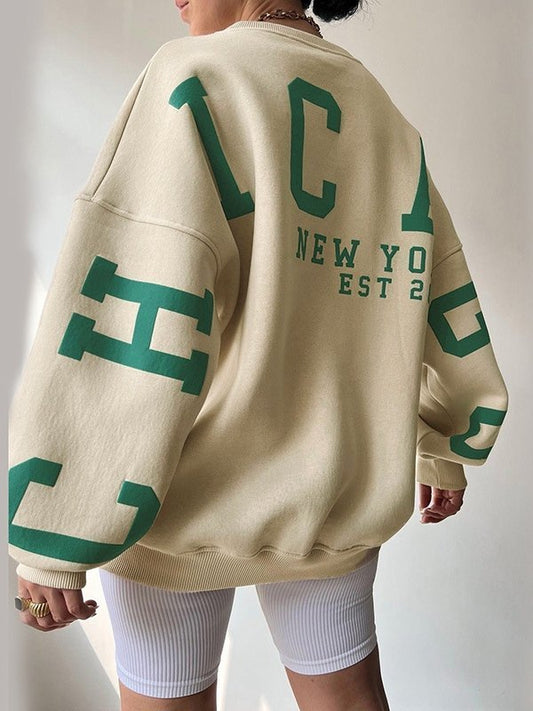 Oversized varsity sweatshirt with green letter graphic
